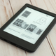 The Kobo Nia e-reader sitting on a wooden table.